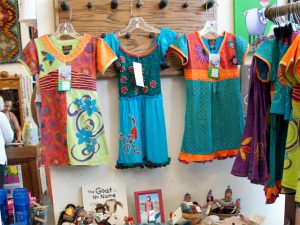These colorful, embroidered dresses from Rising International are part of Scarlett Begonia’s selection of children’s clothing.