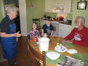 My children, Rosalie and Elliott, helping make biscuits with their grandparents.