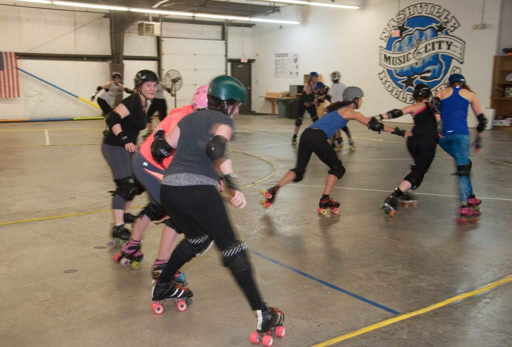 Members of the Nashville Rollergirls practice their moves days ahead of a preseason game. A number of the skaters are moms and have daughters involved with the junior Rollergirls.