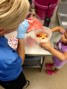A Zookeeper and my daughter, Goldie, make an ice treat.
